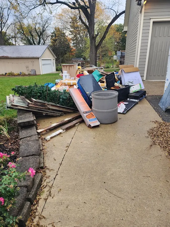Dumpster being loaded with debris for Estate Cleanout Dumpster Rental in Fallston